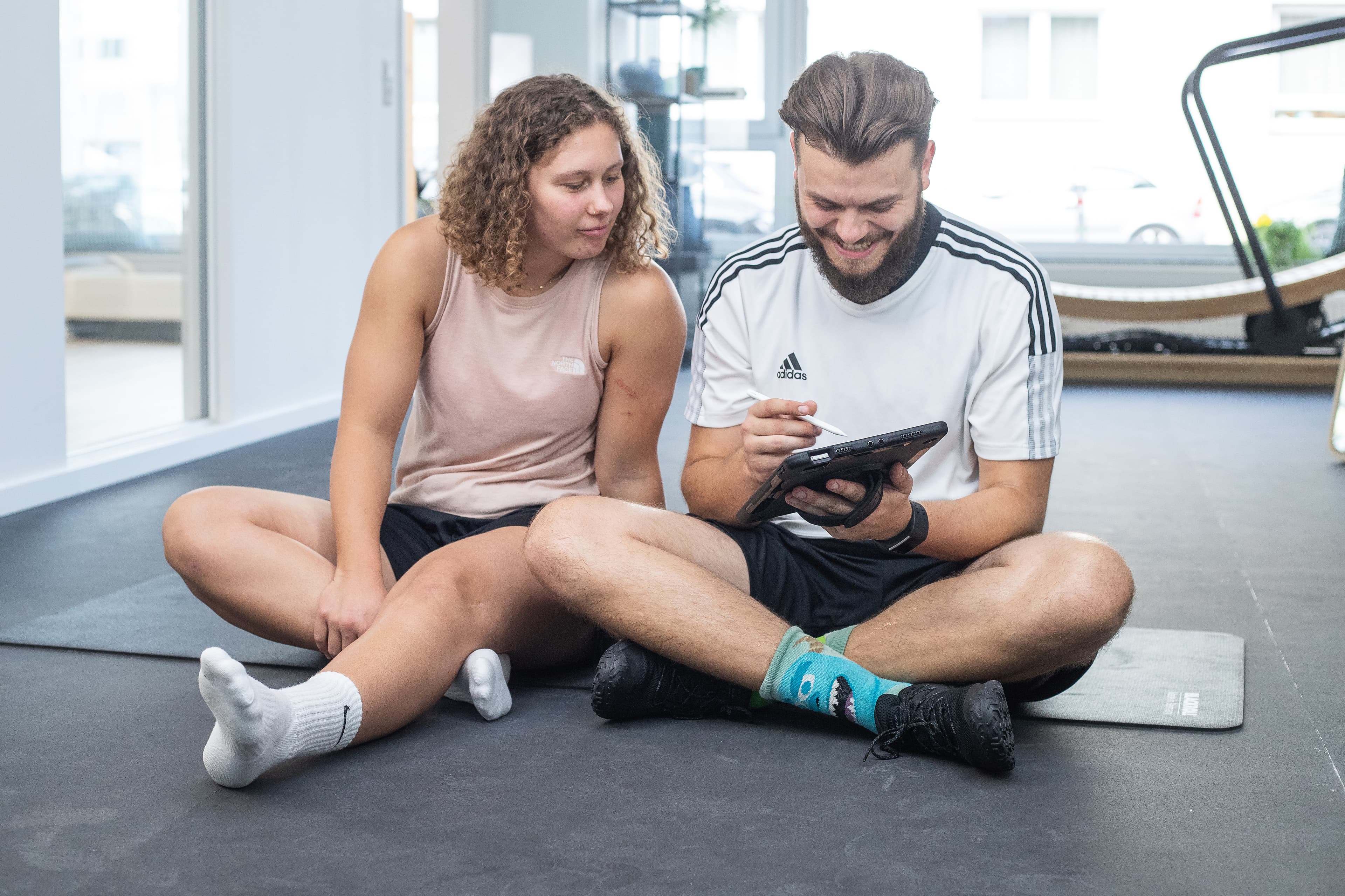 Physiotherapist Josh explaining a training plan to a patient.
